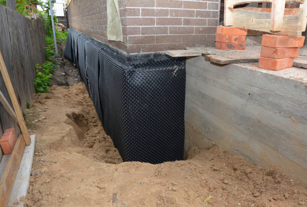 SJ Waterproofing Pros technician performing targeted Emergency Waterproofing assessment in Laotto, IN
